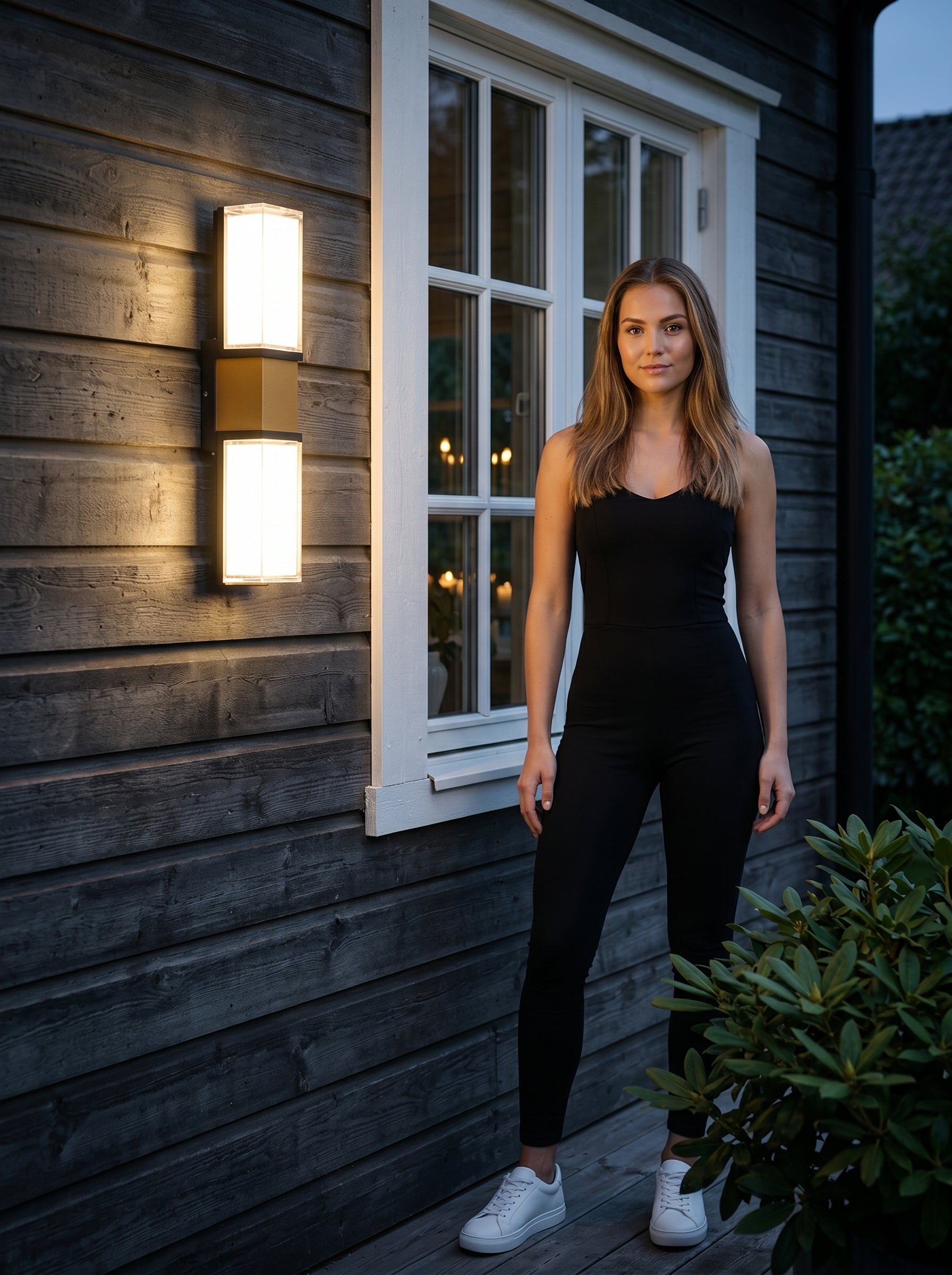 AI Studio Photo - Standing facing the camera, natural confident posture, arms relaxed at sides, front view, full body visible. CAMERA SHOT: A medium shot focusing on the wall lamp, showcasing its full form and how it's mounted on the exterior wall, with a hint of the surrounding environment. [Full body]