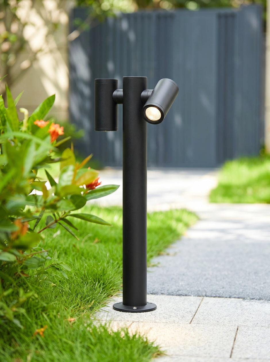 AI Studio Photo - Standing facing the camera, natural confident posture, arms relaxed at sides, front view, full body visible. CAMERA SHOT: Medium shot focusing on the garden light, with a shallow depth of field to blur the background and highlight the product. [Full body]