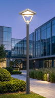 AI Studio Photo - Front face view wearing hat, looking at camera, hat brim visible. CAMERA SHOT: A medium shot focusing on the lamp post, showcasing its full height and the illuminated fixture, with a blurred background to emphasize the product. [Half body styled]